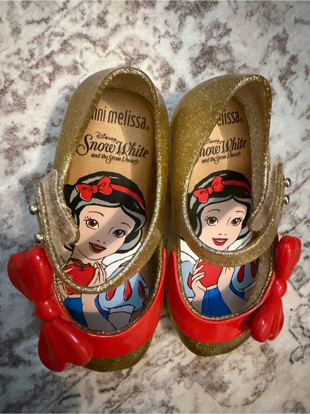 Mini Melissa Gold Glitter Mary Janes with Red Bow Accents